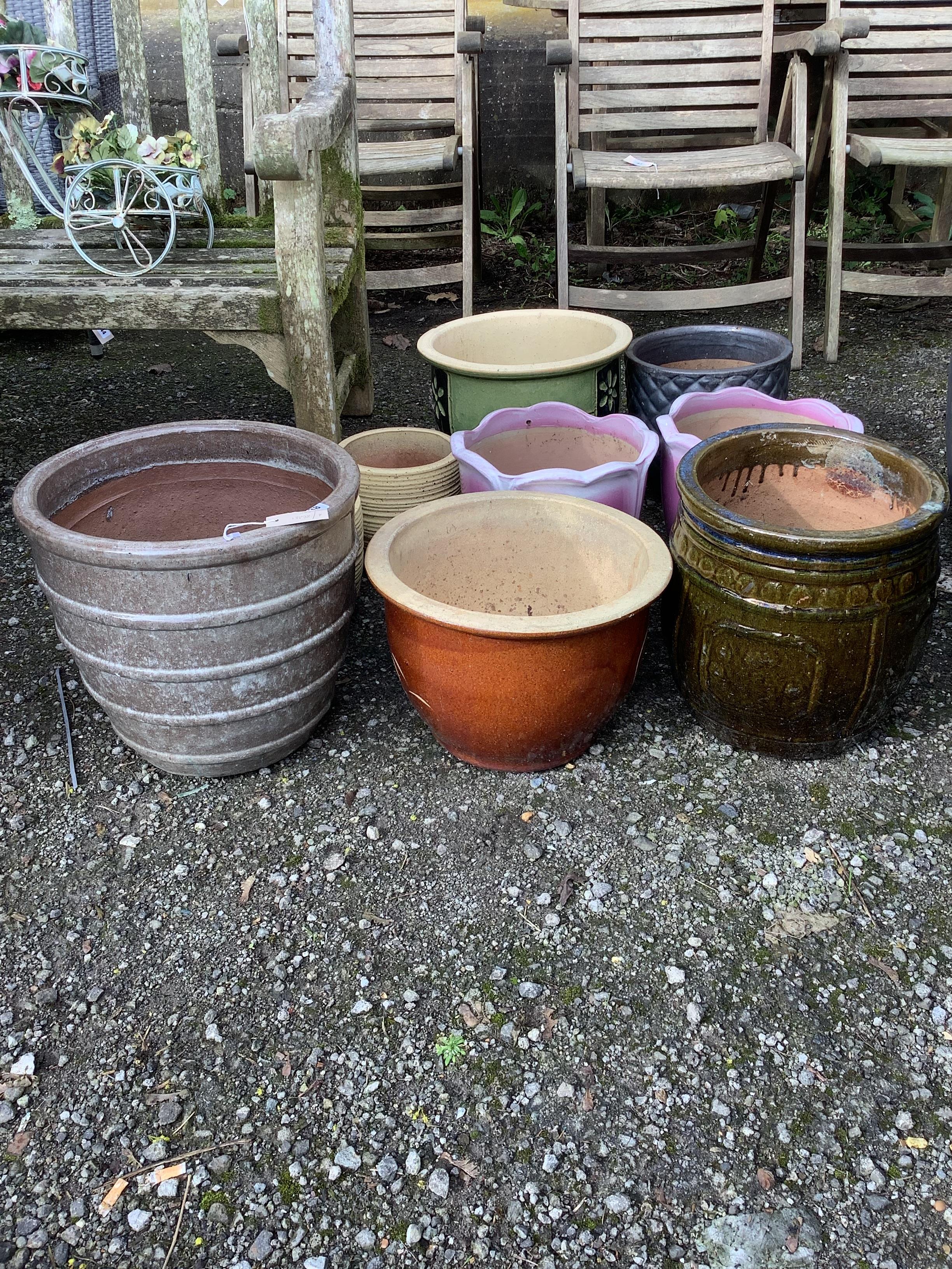 Ten assorted circular glazed earthenware garden planters, largest diameter 38cm, height 38cm